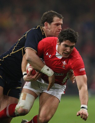 120212 - Wales v Scotland, RBS 6 Nations 2012 -Wales' James Hook is tackled by Scotland's Rory Lamont    