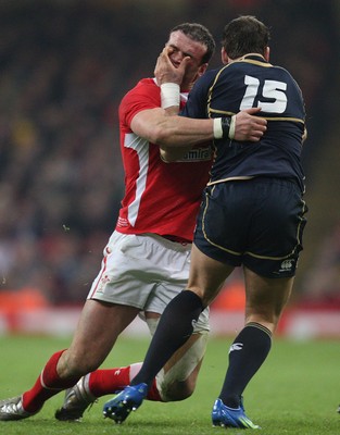 120212 - Wales v Scotland, RBS 6 Nations 2012 -Wales' Jamie Roberts is handed off by Scotland's Rory Lamont  