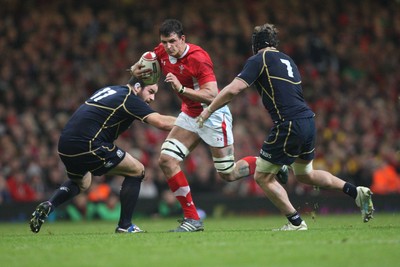 120212 - Wales v Scotland, RBS 6 Nations 2012 -Wales' Aaron Shingler takes on Scotland's Ross Rennie and Scotland's Ed Kalman     