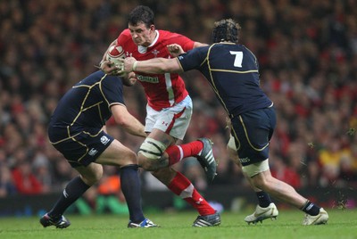 120212 - Wales v Scotland, RBS 6 Nations 2012 -Wales' Aaron Shingler takes on Scotland's Ross Rennie and Scotland's Ed Kalman     