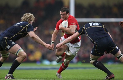 120212 - Wales v Scotland, RBS 6 Nations 2012 -Wales' Jamie Roberts takes on Scotland's Richie Gray and Scotland's Alastair Kellock   