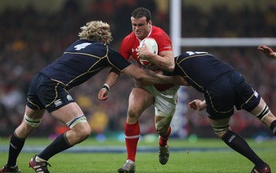 120212 - Wales v Scotland, RBS 6 Nations 2012 -Wales' Jamie Roberts takes on Scotland's Richie Gray and Scotland's Alastair Kellock   