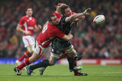 120212 - Wales v Scotland, RBS 6 Nations 2012 -Scotland's David Denton is tackled by Wales' Ken Owens    