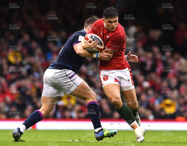 120222 - Wales v Scotland - Guinness Six Nations - Louis Rees-Zammit of Wales is tackled by George Turner of Scotland