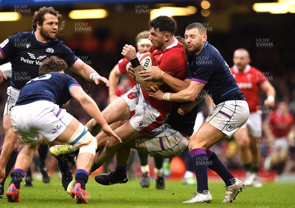 120222 - Wales v Scotland - Guinness Six Nations - Alex Cuthbert of Wales is tackled by Finn Russell of Scotland