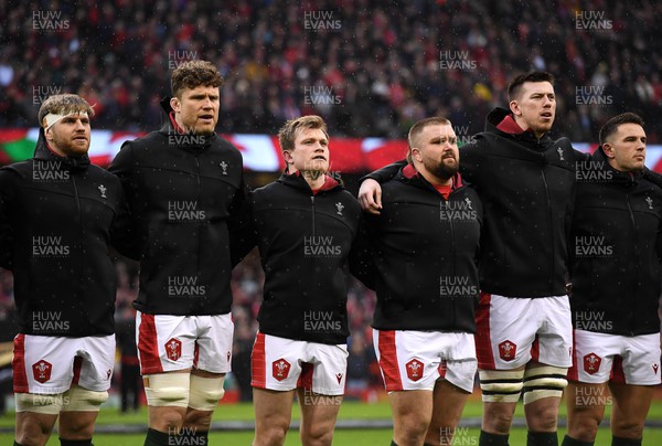 120222 - Wales v Scotland - Guinness Six Nations - Aaron Wainwright, Will Rowlands, Nick Tompkins, Tomas Francis, Adam Beard of Wales during the anthems