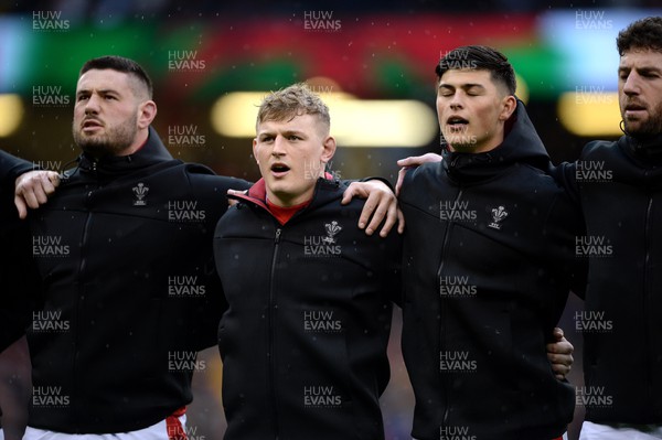 120222 - Wales v Scotland - Guinness Six Nations - Gareth Thomas, Jac Morgan and Louis Rees-Zammit of Wales during the anthems