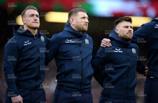 120222 - Wales v Scotland - Guinness Six Nations - Stuart Hogg, Finn Russell and Ali Price of Scotland during the anthems