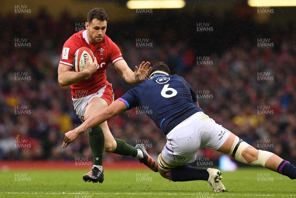 120222 - Wales v Scotland - Guinness Six Nations - Tomos Williams of Wales is tackled by Sam Skinner of Scotland