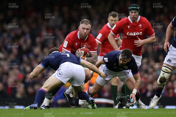 120222 - Wales v Scotland - Guinness Six Nations Championship - Ross Moriarty of Wales is tackled by Hamish Watson of Scotland