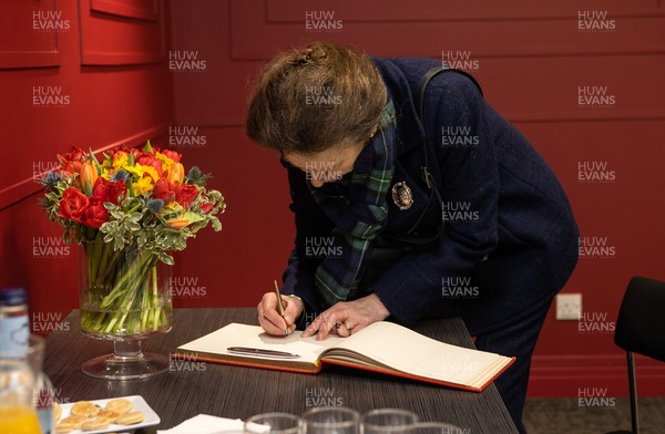 120222 - Wales v Scotland - Guinness Six Nations Championship - Anne, Princess Royal signs the visitors book