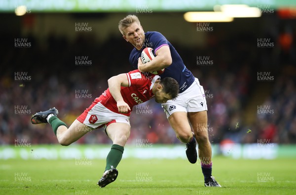 120222 - Wales v Scotland 2022 Guinness Six Nations - Chris Harris of Scotland is tackled by Tomos Williams of Wales