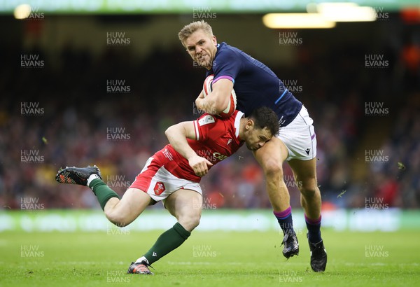 120222 - Wales v Scotland 2022 Guinness Six Nations - Chris Harris of Scotland is tackled by Tomos Williams of Wales