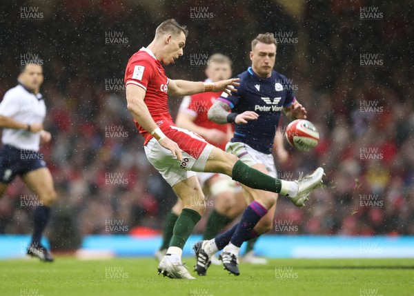120222 - Wales v Scotland 2022 Guinness Six Nations - Liam Williams of Wales kicks the ball clear