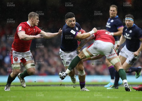 120222 - Wales v Scotland 2022 Guinness Six Nations - Sione Tuipulotu of Scotland takes on Ross Moriarty of Wales