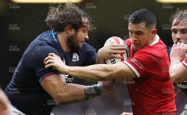 120222 - Wales v Scotland 2022 Guinness Six Nations - Owen Watkin of Wales is tackled by Pierre Schoeman of Scotland