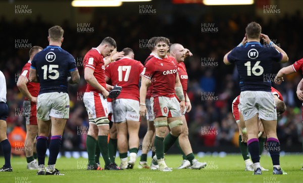120222 - Wales v Scotland 2022 Guinness Six Nations - Taine Basham of Wales looks at Stuart Hogg of Scotland  and George Turner of Scotland as the final whistle is blown