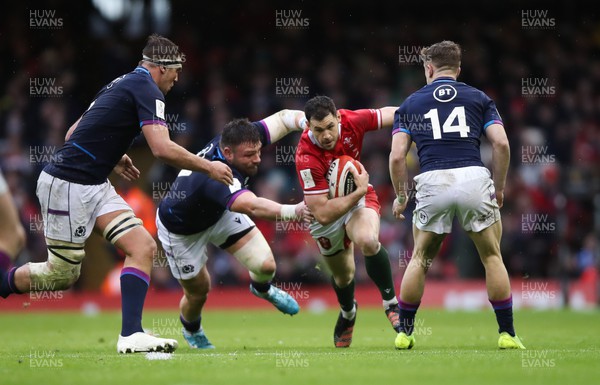 120222 - Wales v Scotland 2022 Guinness Six Nations - Tomos Williams of Wales looks to take on Jonny Gray of Scotland