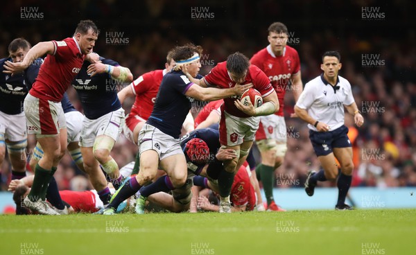120222 - Wales v Scotland 2022 Guinness Six Nations - Taine Basham of Wales looks to hold off Hamish Watson of Scotland 