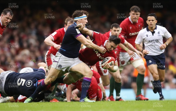 120222 - Wales v Scotland 2022 Guinness Six Nations - Taine Basham of Wales looks to hold off Hamish Watson of Scotland 