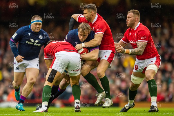 120222 - Wales v Scotland - Guinness Six Nations - Jonny Gray of Scotland  is tackled by Dan Biggar of Wales 