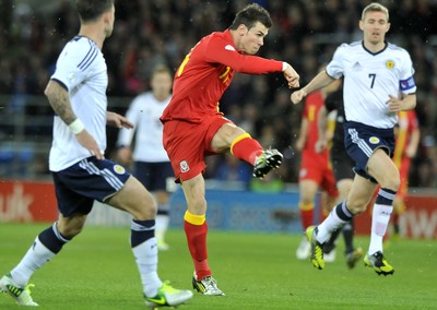 121012 - Wales v Scotland - FIFA 2014 World Cup Qualifying Campaign - Gareth Bale of Wales shoots at goal