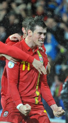 121012 - Wales v Scotland - FIFA 2014 World Cup Qualifying Campaign - Gareth Bale of Wales celebrates scoring the winner 