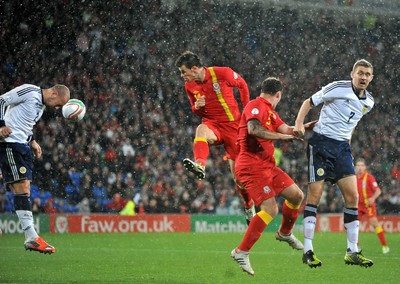 121012 - Wales v Scotland - FIFA 2014 World Cup Qualifying Campaign - Gareth Bale of Wales, centre, heads on goal 