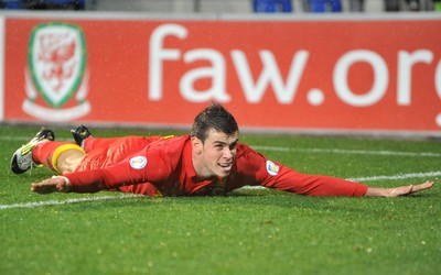 121012 - Wales v Scotland - FIFA 2014 World Cup Qualifying Campaign - Gareth Bale of Wales celebrates scoring the winner 