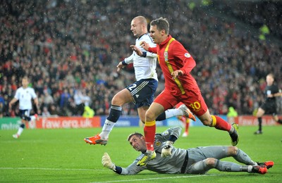 121012 - Wales v Scotland - FIFA 2014 World Cup Qualifying Campaign - Aaron Ramsey of Wales shoots at goal after beating Scotland keeper Allan McGregor 