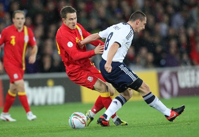 121012 - Wales v Scotland,  FIFA 2014 World Cup Qualifier -Wales' Aaron Ramsey takes on Scotland's Scott Brown