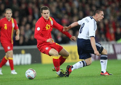121012 - Wales v Scotland,  FIFA 2014 World Cup Qualifier -Wales' Aaron Ramsey takes on Scotland's Scott Brown