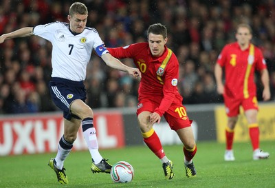 121012 - Wales v Scotland,  FIFA 2014 World Cup Qualifier -Wales' Aaron Ramsey takes on Scotland's Darren Fletcher