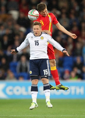 121012 - Wales v Scotland,  FIFA 2014 World Cup Qualifier -Scotland's Kris Commons and Wales' Ben Davies compete for the ball