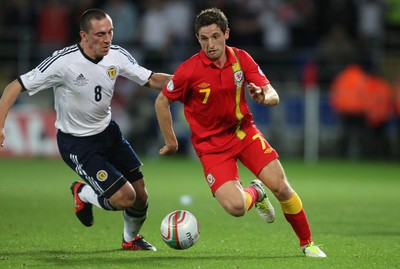 121012 - Wales v Scotland,  FIFA 2014 World Cup Qualifier -Wales' Joe Allen takes on Scotland's Scott Brown