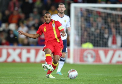 121012 - Wales v Scotland,  FIFA 2014 World Cup Qualifier -Wales' Ashley Williams plays the ball forward