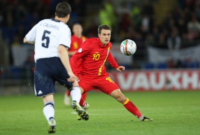 121012 - Wales v Scotland,  FIFA 2014 World Cup Qualifier -Wales' Aaron Ramsey takes on Scotland's Gary Caldwell