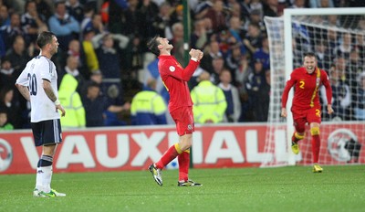 121012 - Wales v Scotland,  FIFA 2014 World Cup Qualifier -Wales' Gareth Bale celebrates at the end of the match as Scotland's Daniel Fox looks on