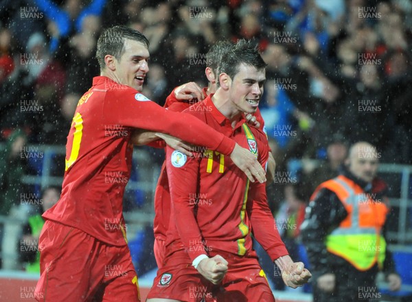 121012 - Wales v Scotland - FIFA 2014 World Cup Qualifying Campaign - Gareth Bale of Wales celebrates scoring the winner with Aaron Ramsey 