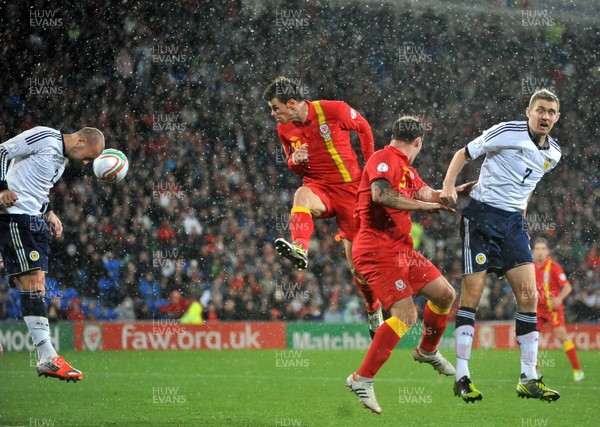 121012 - Wales v Scotland - FIFA 2014 World Cup Qualifying Campaign - Gareth Bale of Wales, centre, heads on goal 