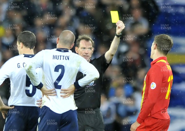 121012 - Wales v Scotland - FIFA 2014 World Cup Qualifying Campaign - Aaron Ramsey of Wales receives a yellow card 