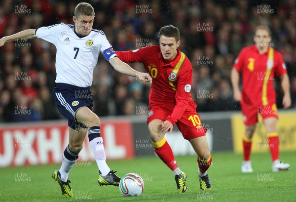 121012 - Wales v Scotland,  FIFA 2014 World Cup Qualifier -Wales' Aaron Ramsey takes on Scotland's Darren Fletcher