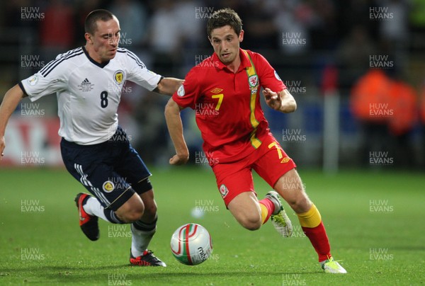 121012 - Wales v Scotland,  FIFA 2014 World Cup Qualifier -Wales' Joe Allen takes on Scotland's Scott Brown