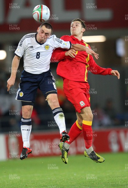 121012 - Wales v Scotland,  FIFA 2014 World Cup Qualifier -Scotland's Scott Brown and Wales' Aaron Ramsey compete for the ball