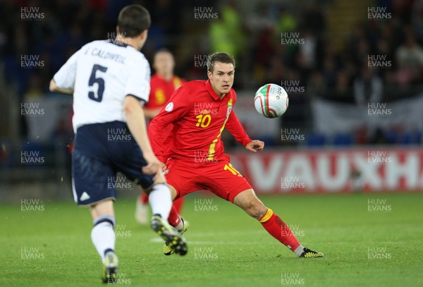 121012 - Wales v Scotland,  FIFA 2014 World Cup Qualifier -Wales' Aaron Ramsey takes on Scotland's Gary Caldwell