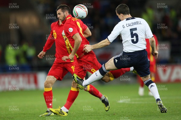 121012 - Wales v Scotland,  FIFA 2014 World Cup Qualifier -Wales' Joe Ledley is brought down by Scotland's Gary Caldwell