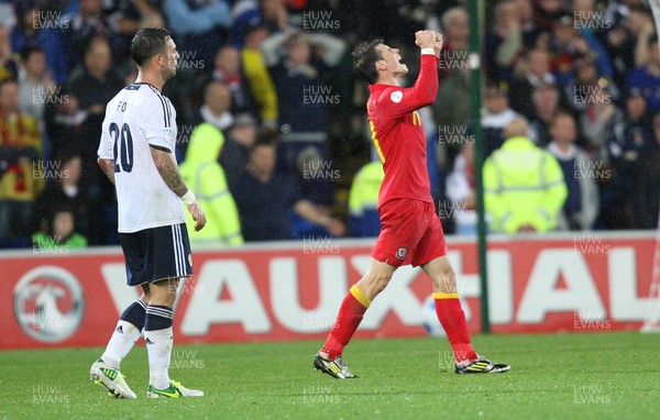 121012 - Wales v Scotland,  FIFA 2014 World Cup Qualifier -Wales' Gareth Bale celebrates at the end of the match as Scotland's Daniel Fox looks on