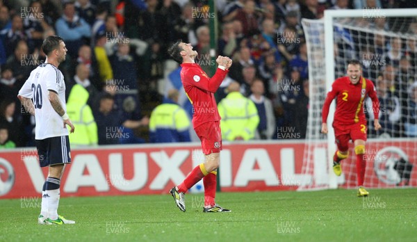 121012 - Wales v Scotland,  FIFA 2014 World Cup Qualifier -Wales' Gareth Bale celebrates at the end of the match as Scotland's Daniel Fox looks on
