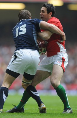 13.02.10 - Wales v Scotland - RBS Six Nations 2010 - Stephen Jones of Wales takes on Sean Lamont of Scotland. 