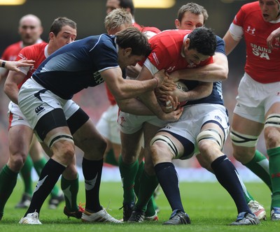13.02.10 - Wales v Scotland - RBS Six Nations 2010 - Stephen Jones of Wales takes on Sean Lamont and John Barclay of Scotland. 